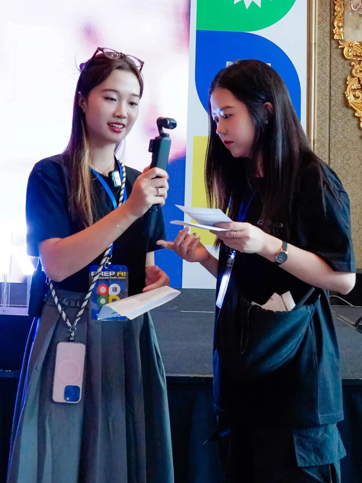 Filming on site with a handheld camera during the event