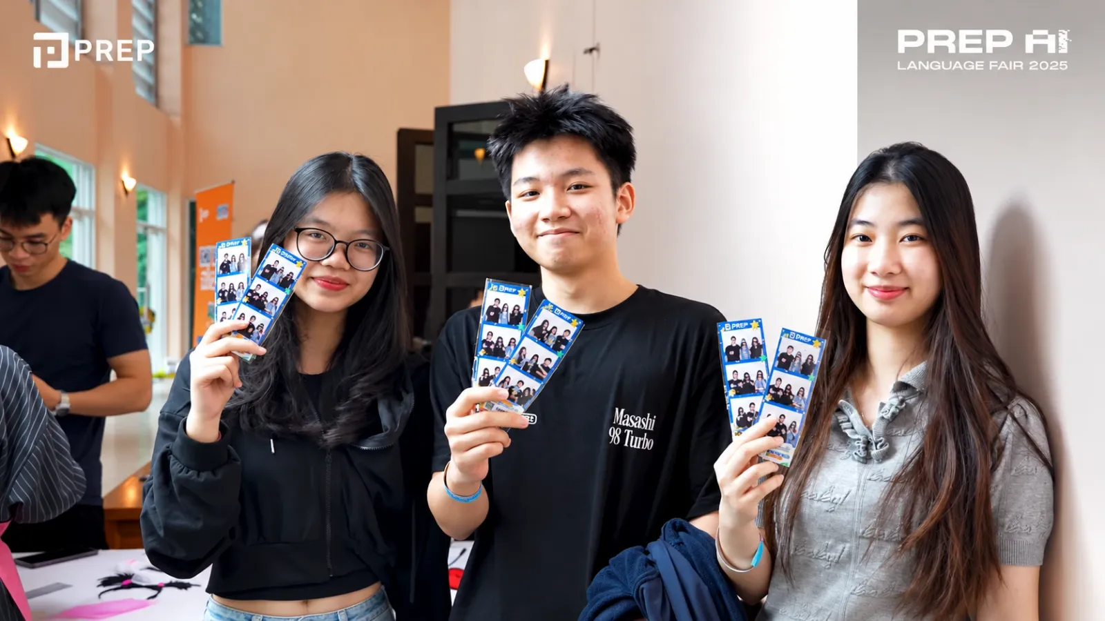 Guests holding their PREP photobooth prints
